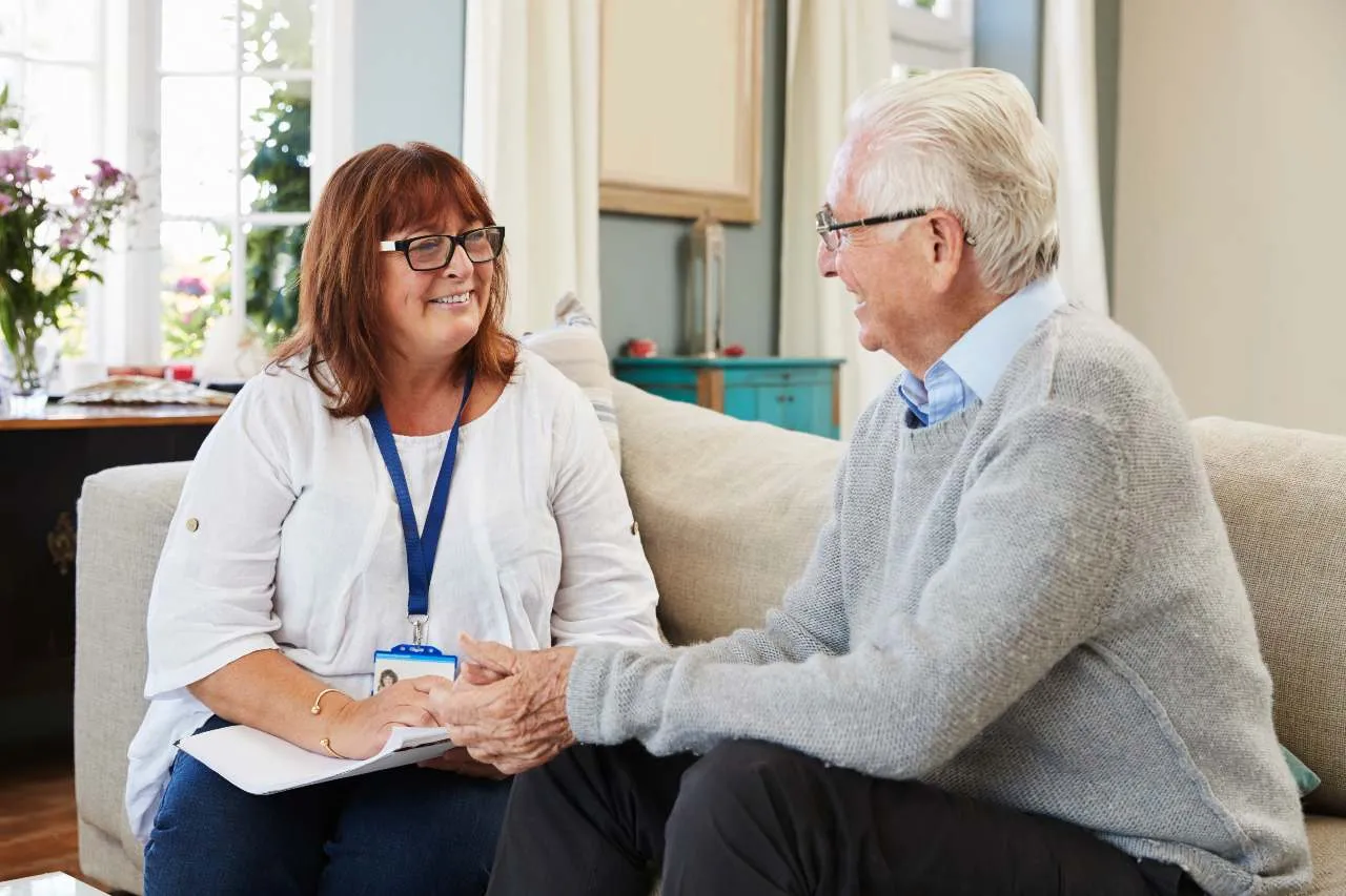 social worker in healthcare working with elderly patient